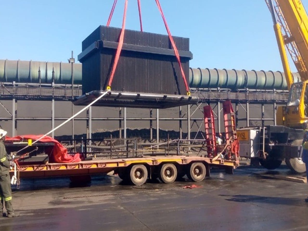 Mining equipment loaded onto truck during logistics transport project